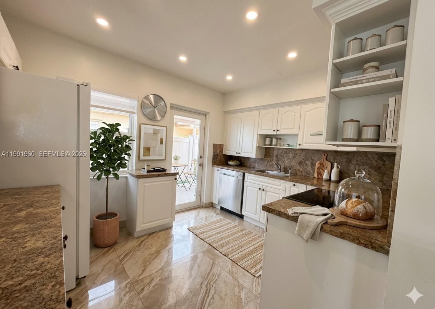 625 East 8th Lane Hialeah, FL 33010 - Photo 4 of 46 a kitchen with sink and cabinets