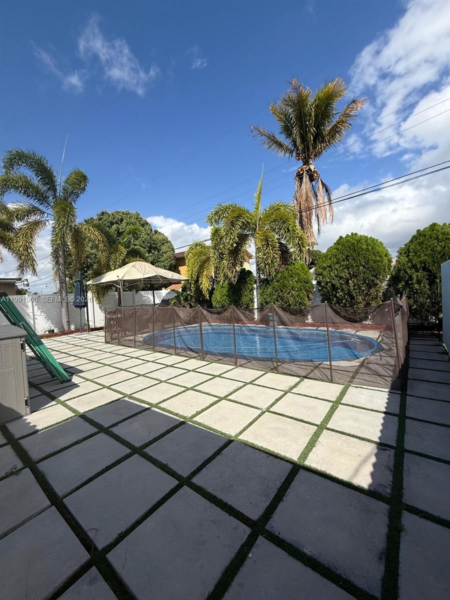 625 East 8th Lane Hialeah, FL 33010 - Photo 41 of 46 a view of a backyard of the house