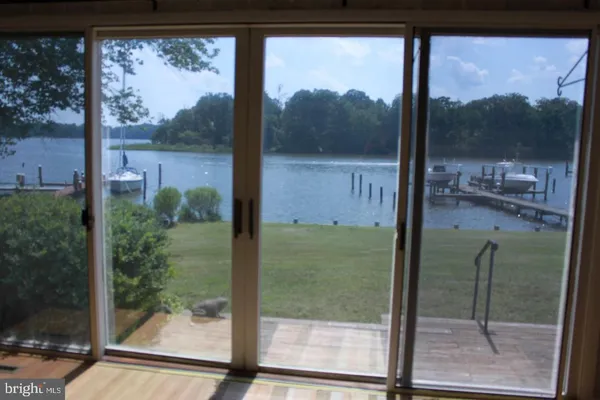 a bathroom with a glass door and a glass door