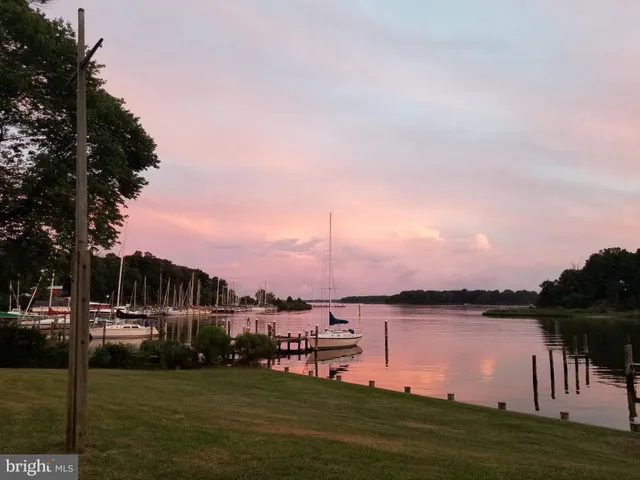 a kitchen with white cabinets stainless steel appliances and sink