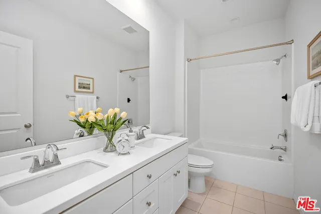 a bathroom with a sink a toilet and a bathtub