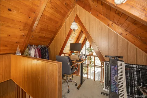 a bedroom with a bed next to a window