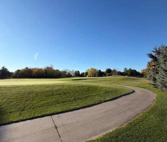 a view of a lake with a big yard