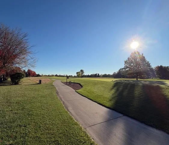 a view of a lake with a yard