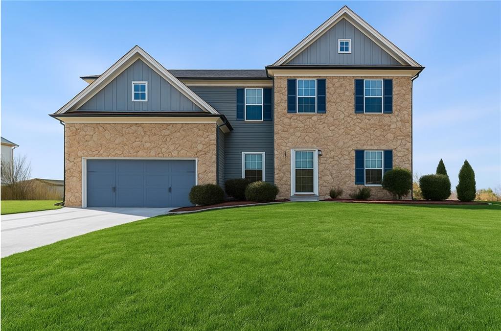 3181 Day Break Lane Dacula, GA 30019 - Photo 1 of 25 a front view of a house with a yard and garage