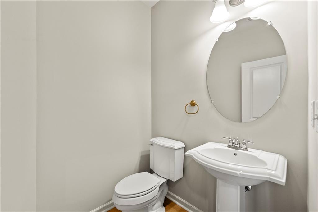 3181 Day Break Lane Dacula, GA 30019 - Photo 21 of 25 a bathroom with a sink mirror and toilet