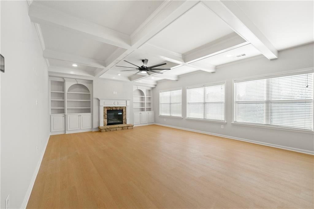 3181 Day Break Lane Dacula, GA 30019 - Photo 6 of 25 an empty room with windows and fireplace