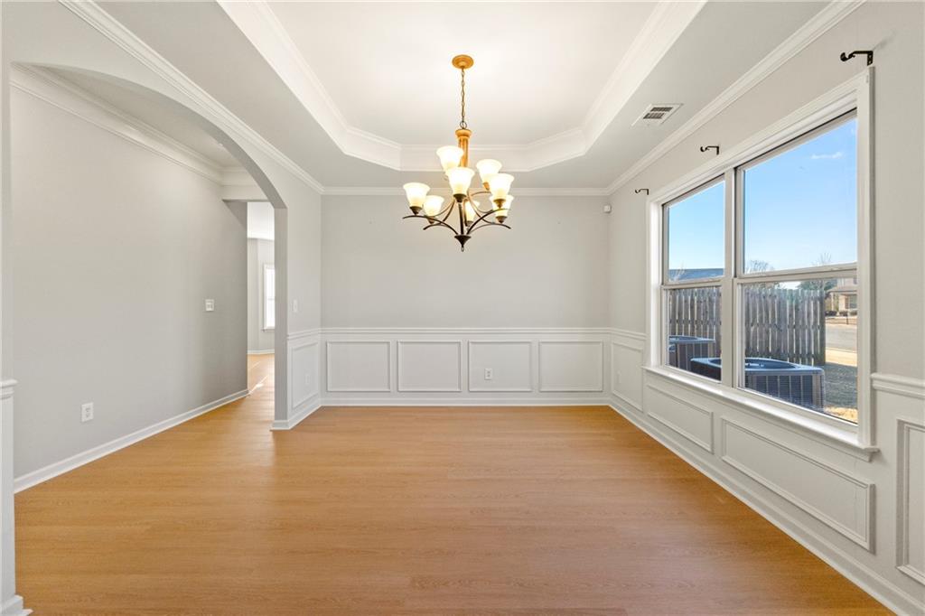 3181 Day Break Lane Dacula, GA 30019 - Photo 8 of 25 a view of a room with window chandelier and glass door