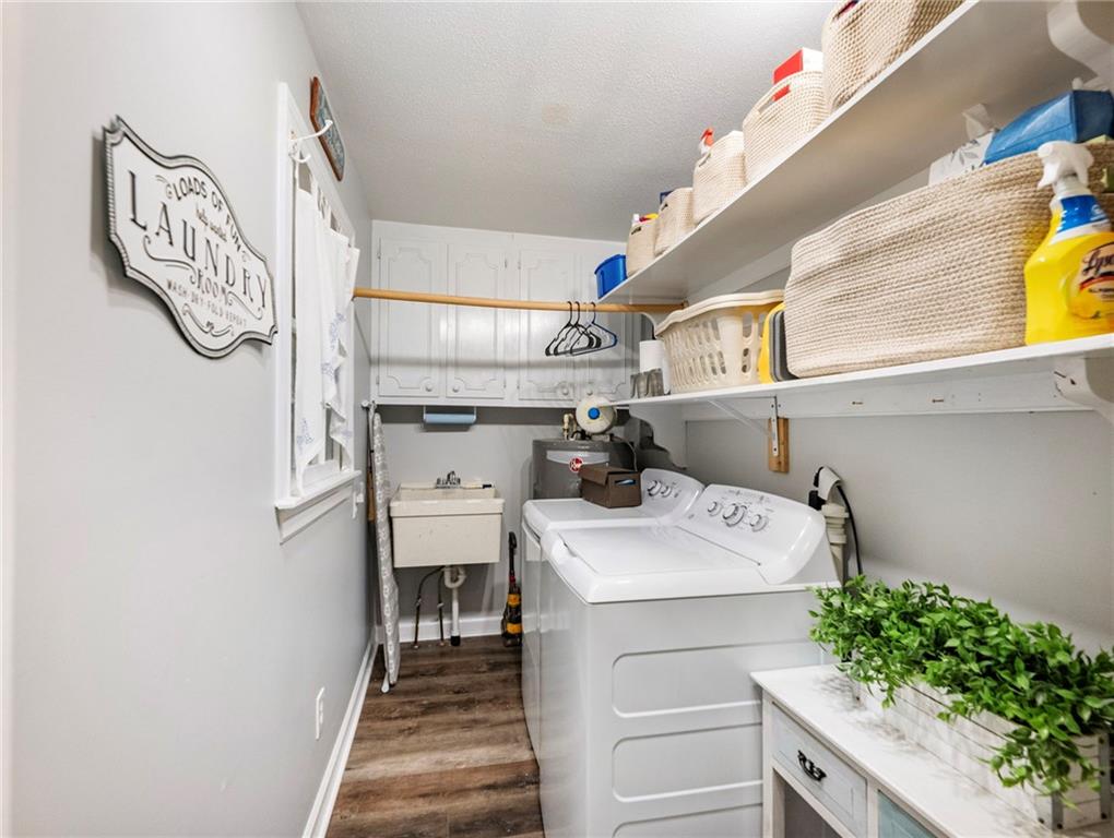 945 Poplar Street Monroe, GA 30655 - Photo 22 of 55 a utility room with sink dryer and washer