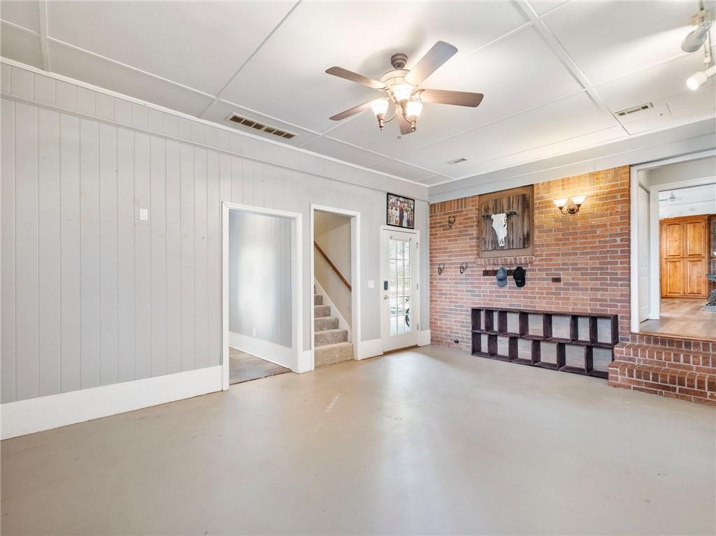 945 Poplar Street Monroe, GA 30655 - Photo 25 of 55 en empty room with windows and ceiling fan