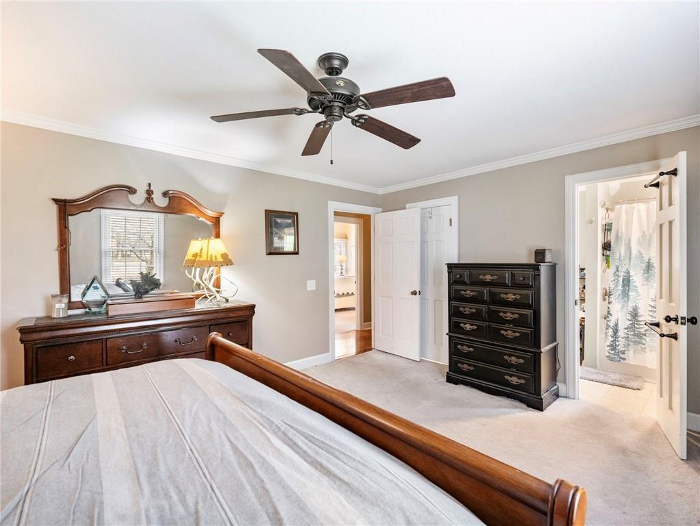 945 Poplar Street Monroe, GA 30655 - Photo 38 of 55 a bed room with a bed and a television