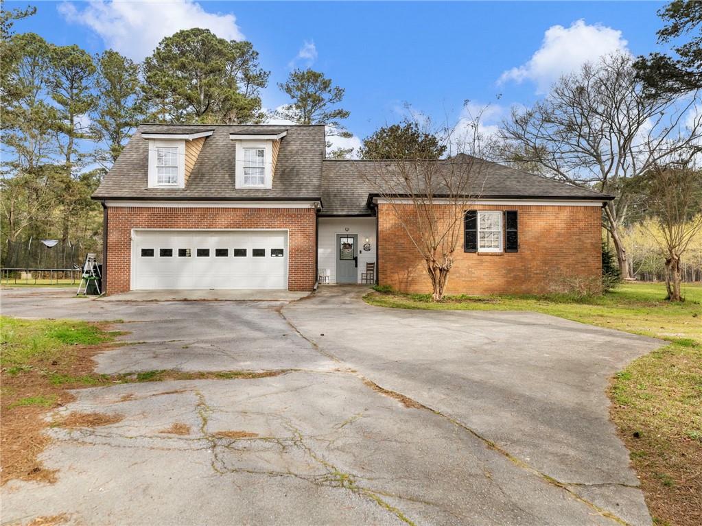945 Poplar Street Monroe, GA 30655 - Photo 44 of 55 front view of a house with a street