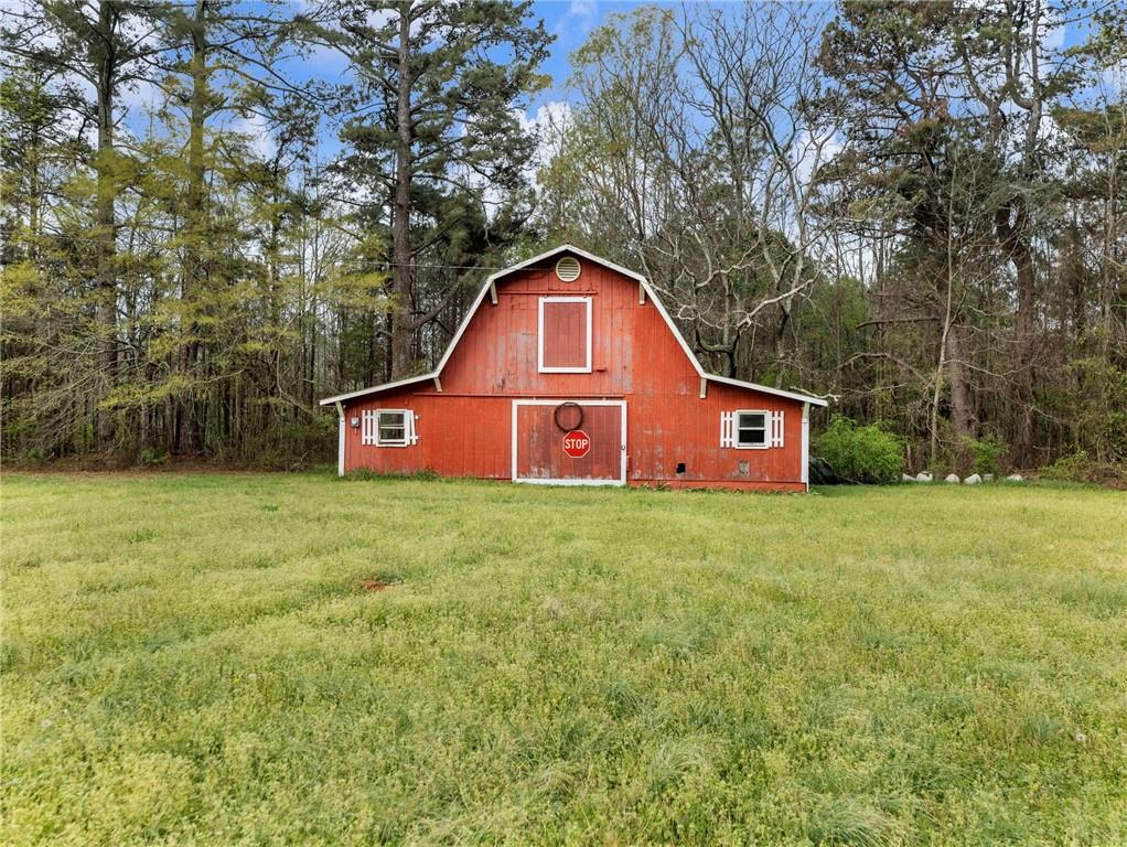 945 Poplar Street Monroe, GA 30655 - Photo 50 of 55 a view of a back yard with green space
