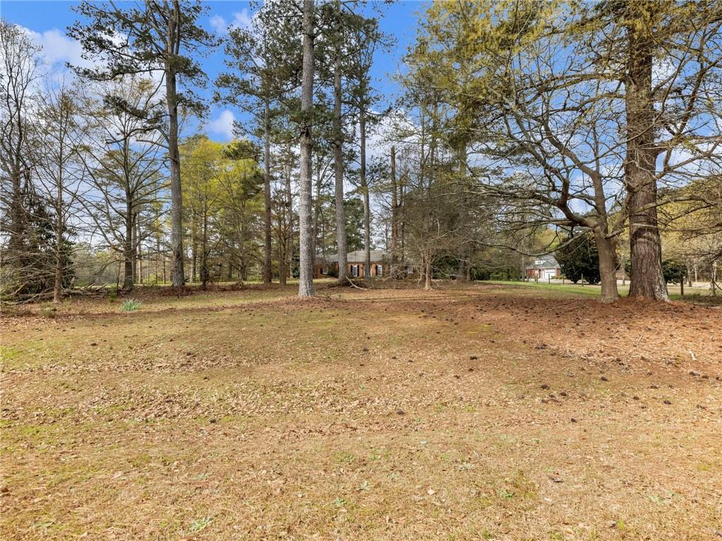 945 Poplar Street Monroe, GA 30655 - Photo 54 of 55 a view of outdoor space with trees