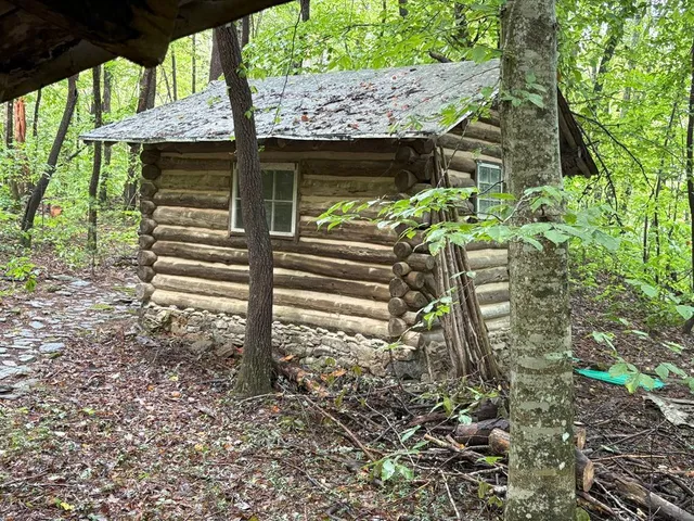 a view of a house with a window in a yard
