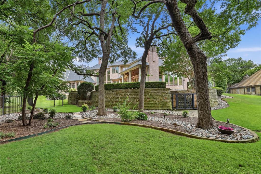 6512 Old Gate Road Plano, TX 75024 - Photo 6 of 40 There's enough room to spread out and for whatever you want in this back yard, and it backs to a creek!