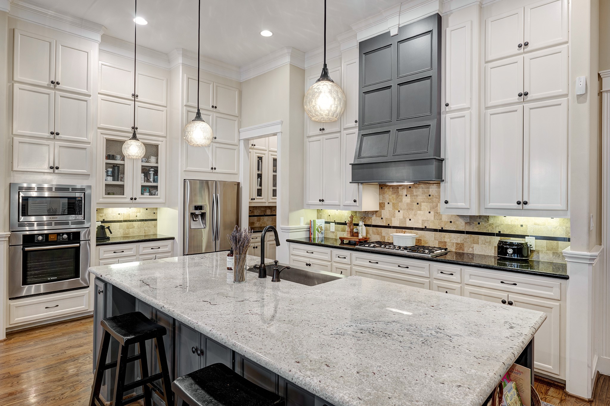 1010 Nicholson Street Houston, TX 77008 - Photo 6 of 28 a kitchen with stainless steel appliances granite countertop a sink refrigerator and cabinets