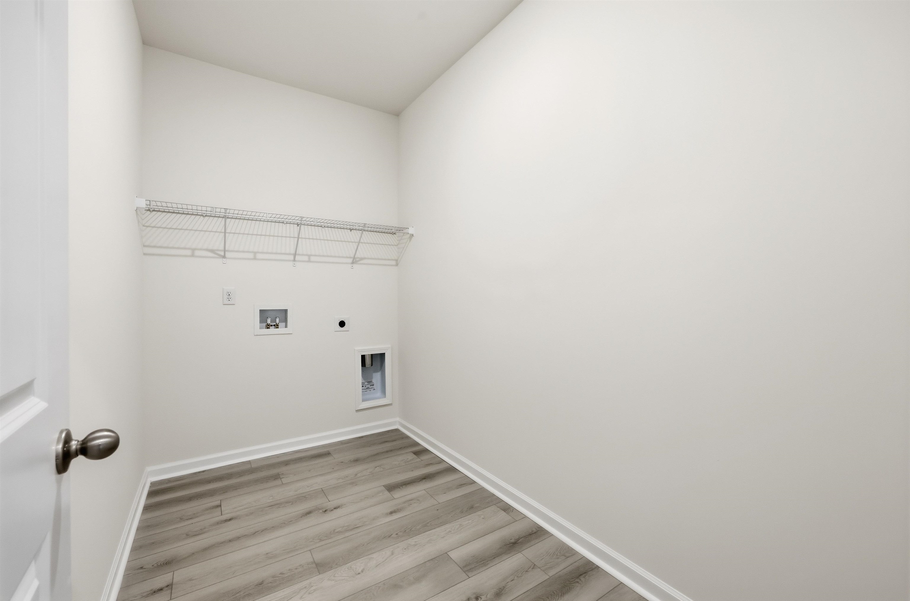 141 River Birch Drive Loris, SC 29569 - Photo 13 of 37 Laundry room with light wood-type flooring, hookup for an electric dryer, and washer hookup