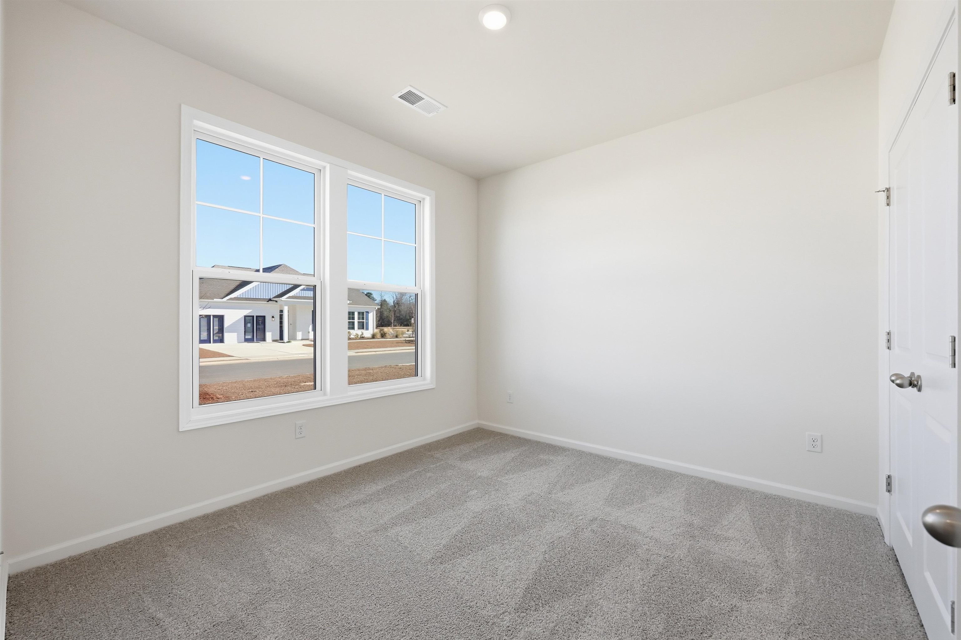 141 River Birch Drive Loris, SC 29569 - Photo 17 of 37 Spare room with light carpet and recessed lighting