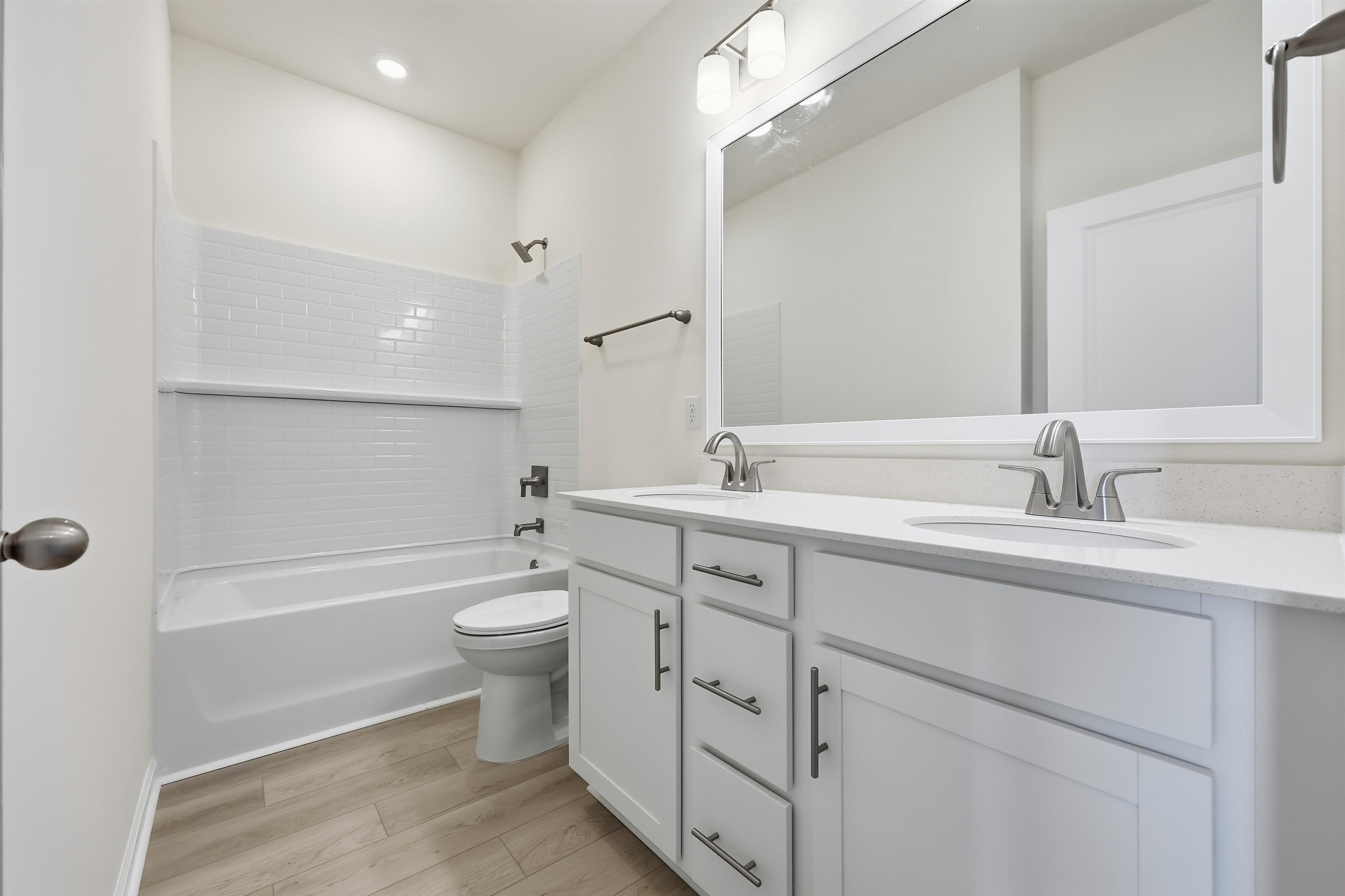 141 River Birch Drive Loris, SC 29569 - Photo 18 of 37 Full bath featuring washtub / shower combination, double vanity, and light wood-type flooring