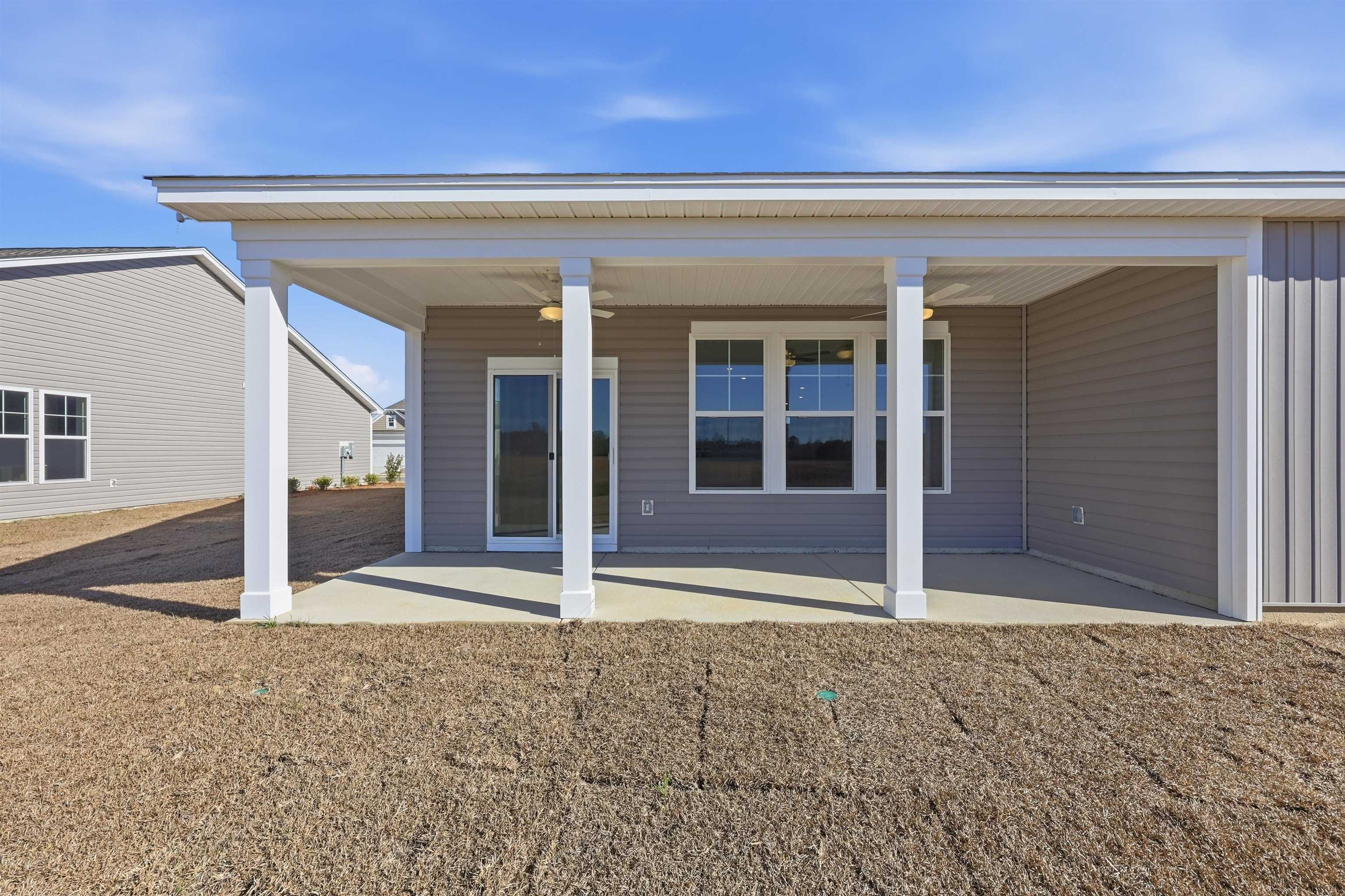 141 River Birch Drive Loris, SC 29569 - Photo 24 of 37 Back of property with ceiling fan and a porch