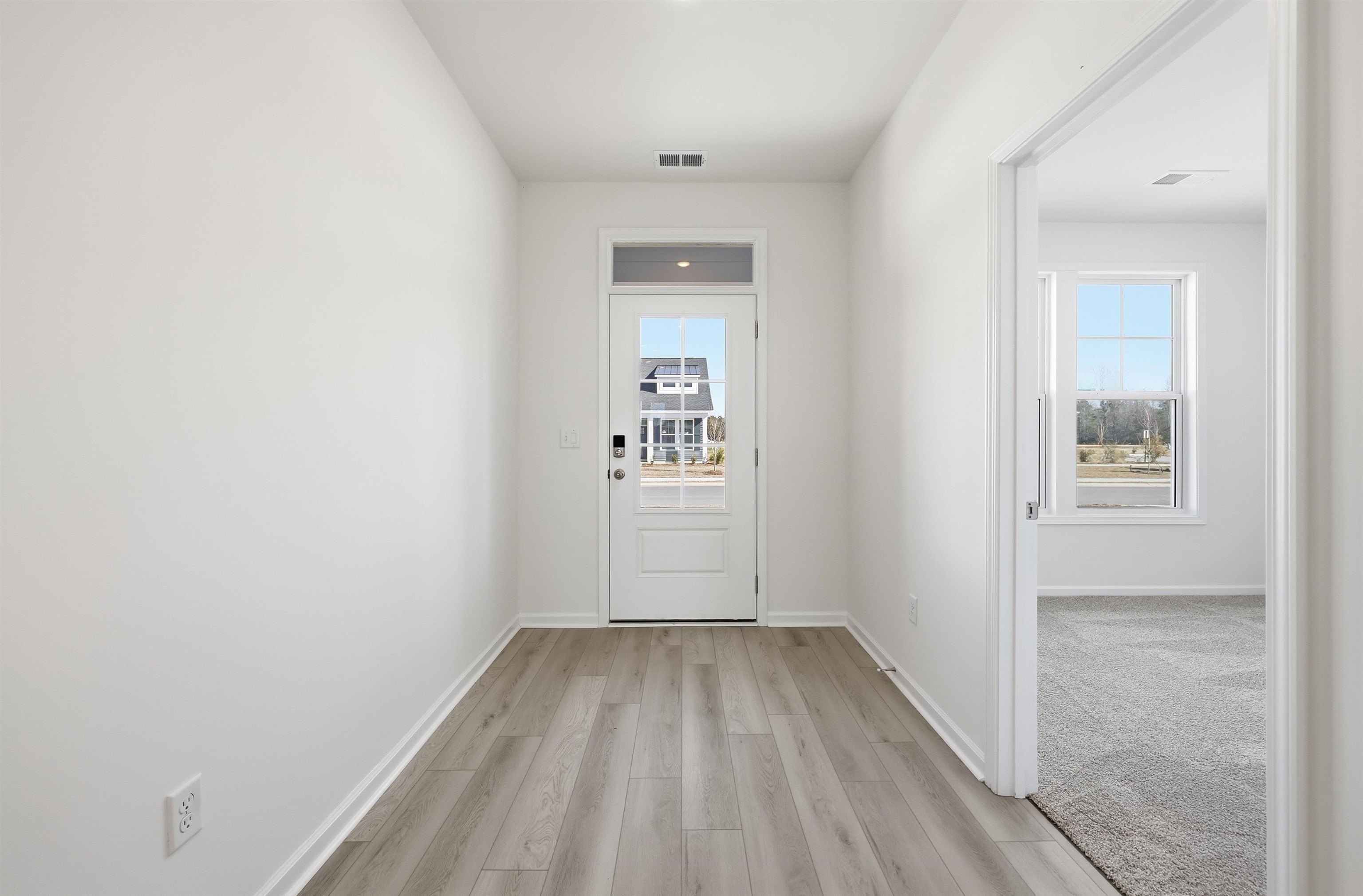 141 River Birch Drive Loris, SC 29569 - Photo 3 of 37 Doorway with wood finished floors and healthy amount of natural light