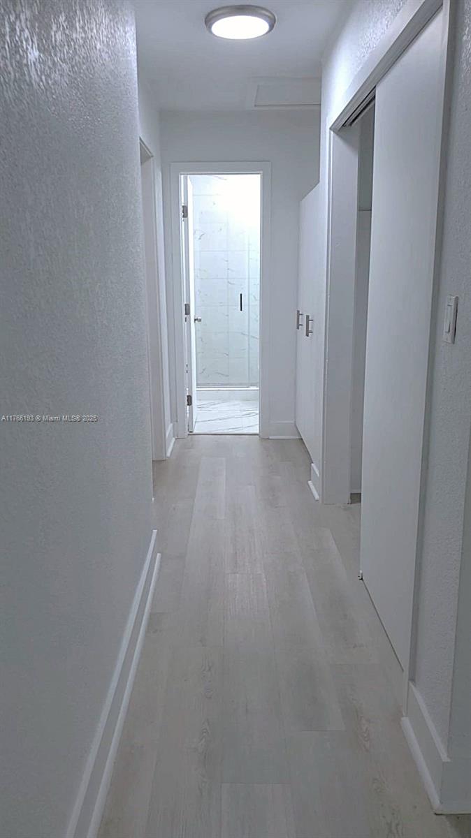 11232 Southwest 5th Street, Unit 2 Sweetwater, FL 33174 - Photo 13 of 24 a view of a room with wooden floor