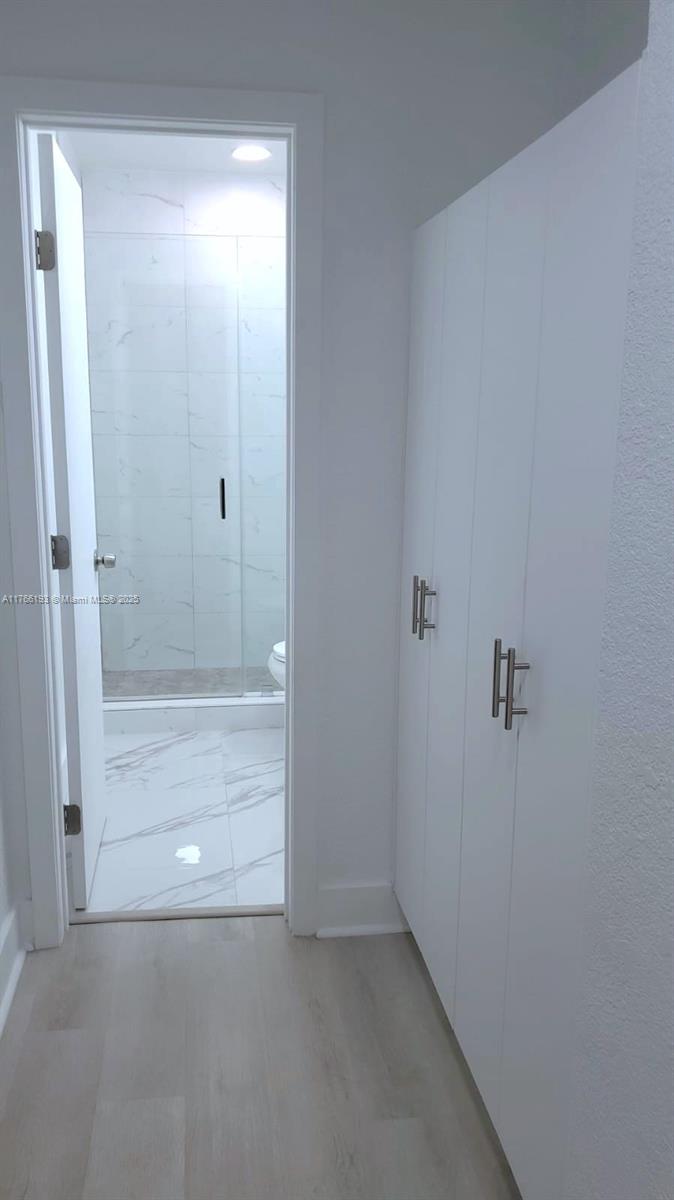 11232 Southwest 5th Street, Unit 2 Sweetwater, FL 33174 - Photo 14 of 24 a bathroom with a bathtub