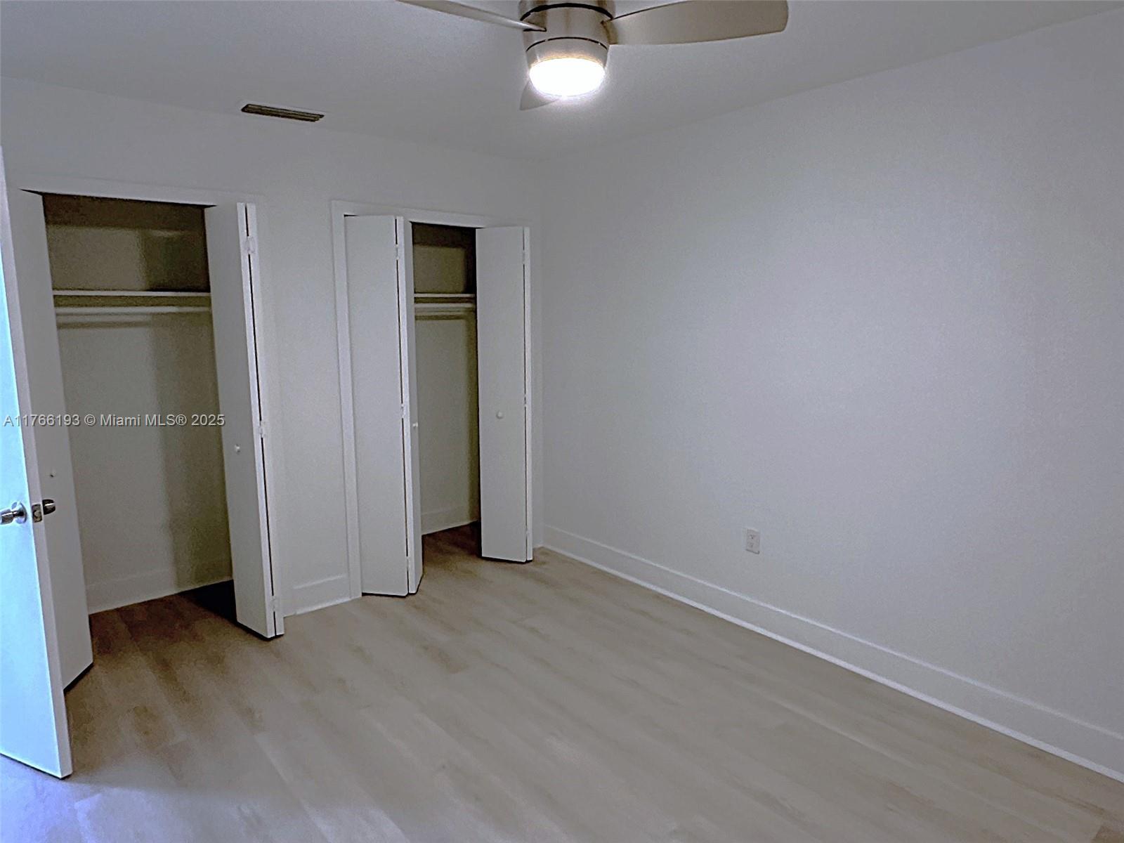 11232 Southwest 5th Street, Unit 2 Sweetwater, FL 33174 - Photo 18 of 24 wooden floor in an empty room