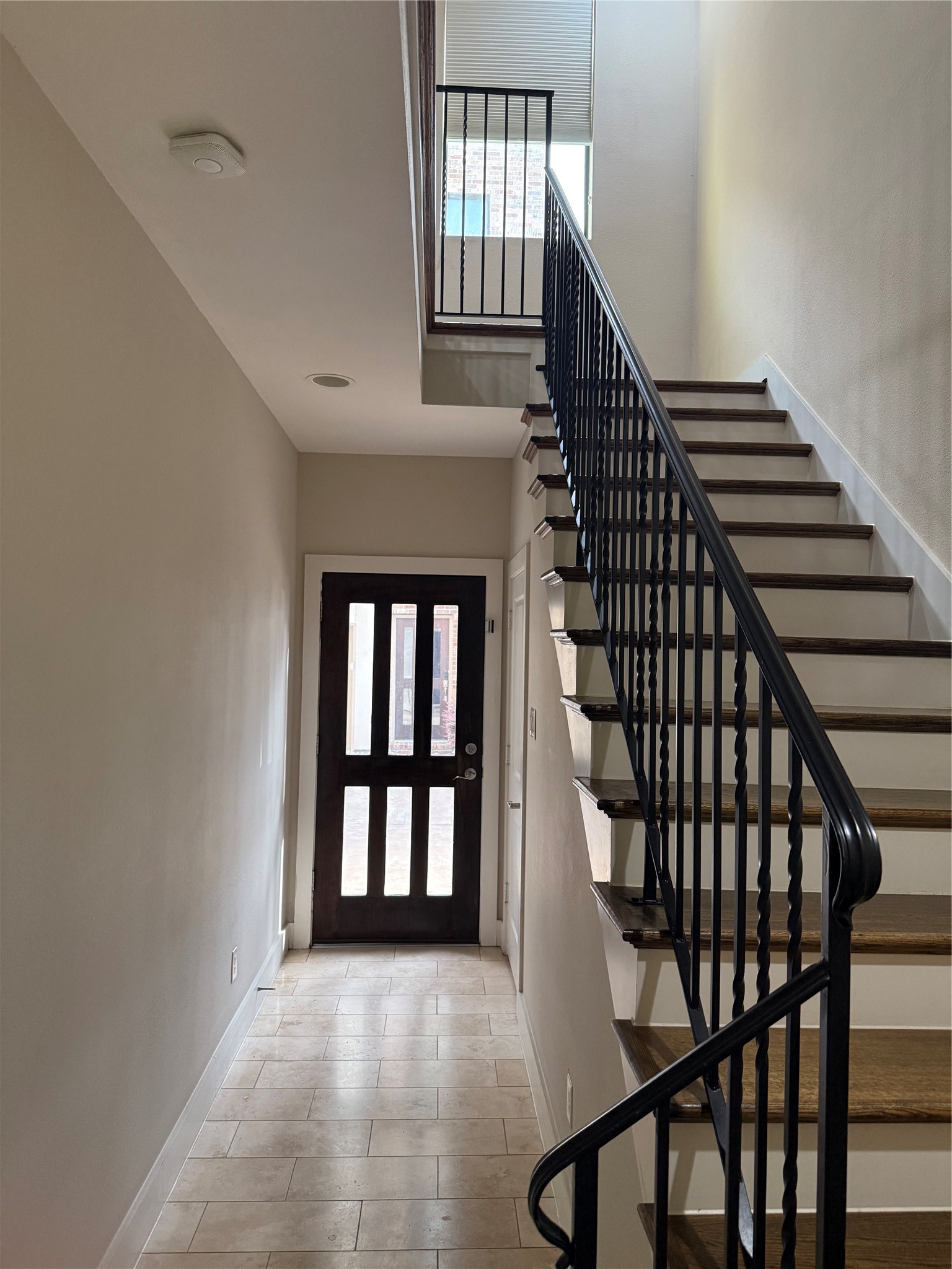 1007 Roberts Street Houston, TX 77003 - Photo 3 of 11 a view of staircase with lots of frames on wall and a window