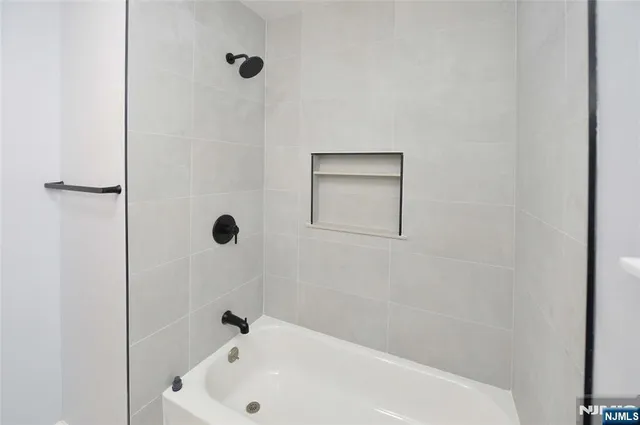 a bathroom with a white tub