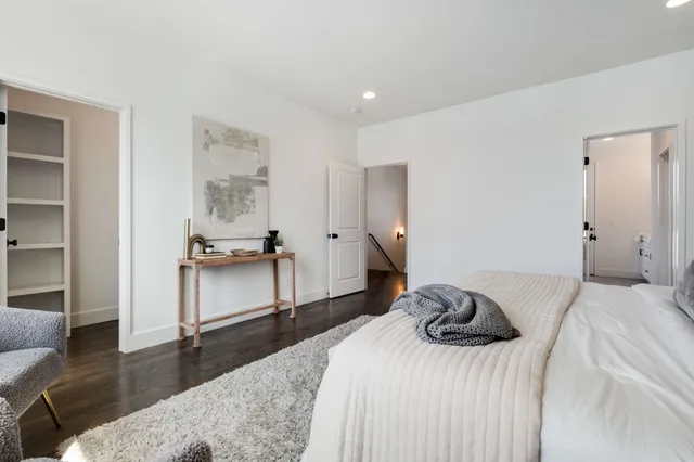 a view of a room with wooden floor and closet
