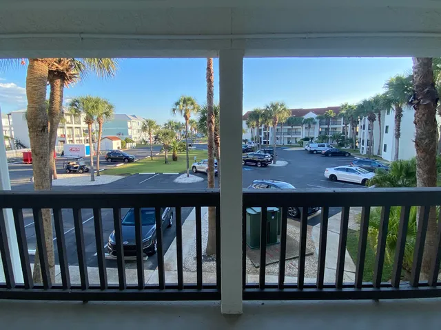 a view of a balcony with furniture