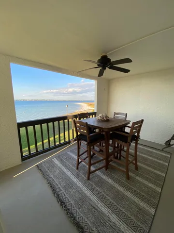a view of a dining room with furniture and window