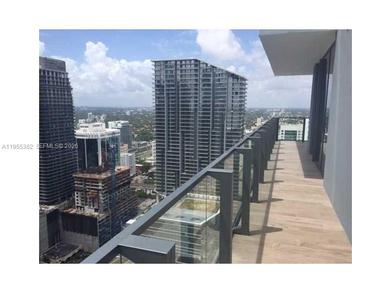 68 Southeast 6th Street, Unit 3502 Miami, FL 33131 - Photo 11 of 16 a view of balcony with wooden floor