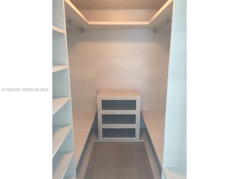 68 Southeast 6th Street, Unit 3502 Miami, FL 33131 - Photo 9 of 16 a view of an empty walk in closet