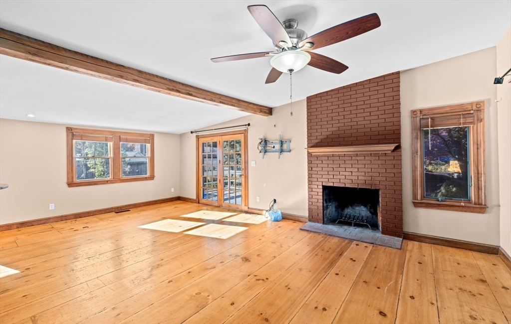 12 Richfield Road Scituate, MA 02066 - Photo 6 of 28 a view of an empty room with a fireplace and a window