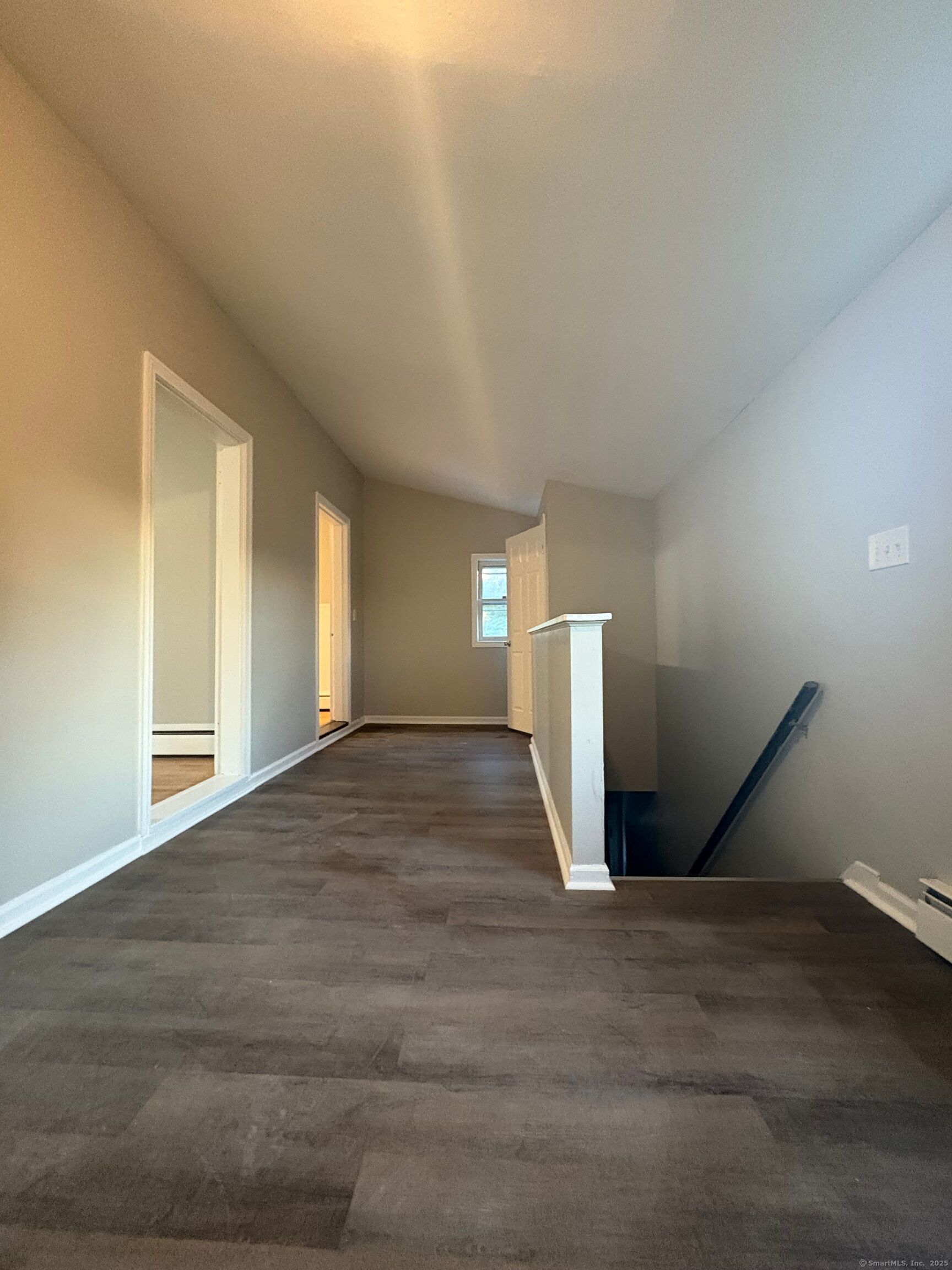 818 Pine Street, Unit 14 Bristol, CT 06010 - Photo 5 of 15 a view of empty room with wooden floor