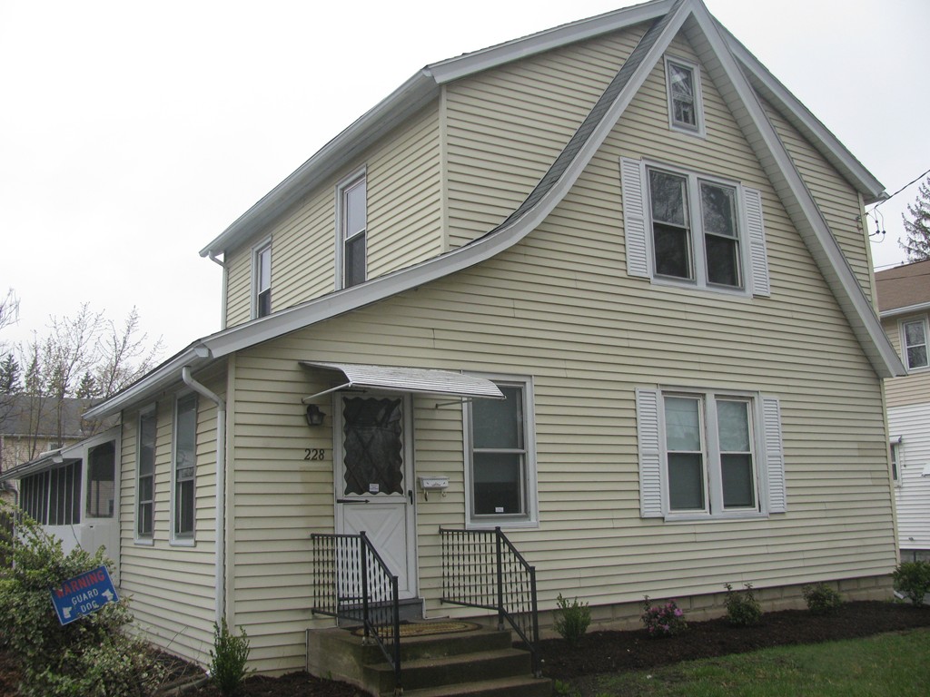 228 Edendale Street Springfield, MA 01104 - Photo 2 of 19 a view of a house with a yard