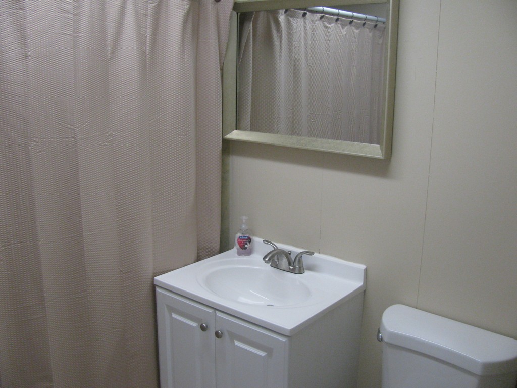228 Edendale Street Springfield, MA 01104 - Photo 9 of 19 a bathroom with a sink and a toilet