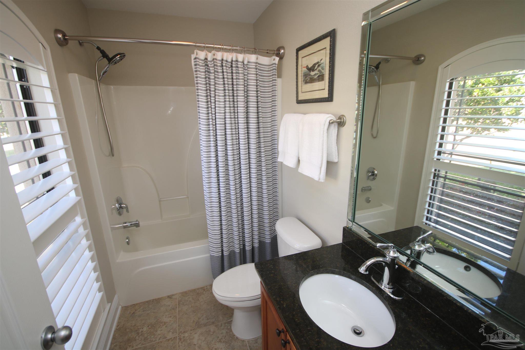 5790 Dunridge Drive Pace, FL 32571 - Photo 28 of 50 Tile flooring, granite & rain shower with wand.