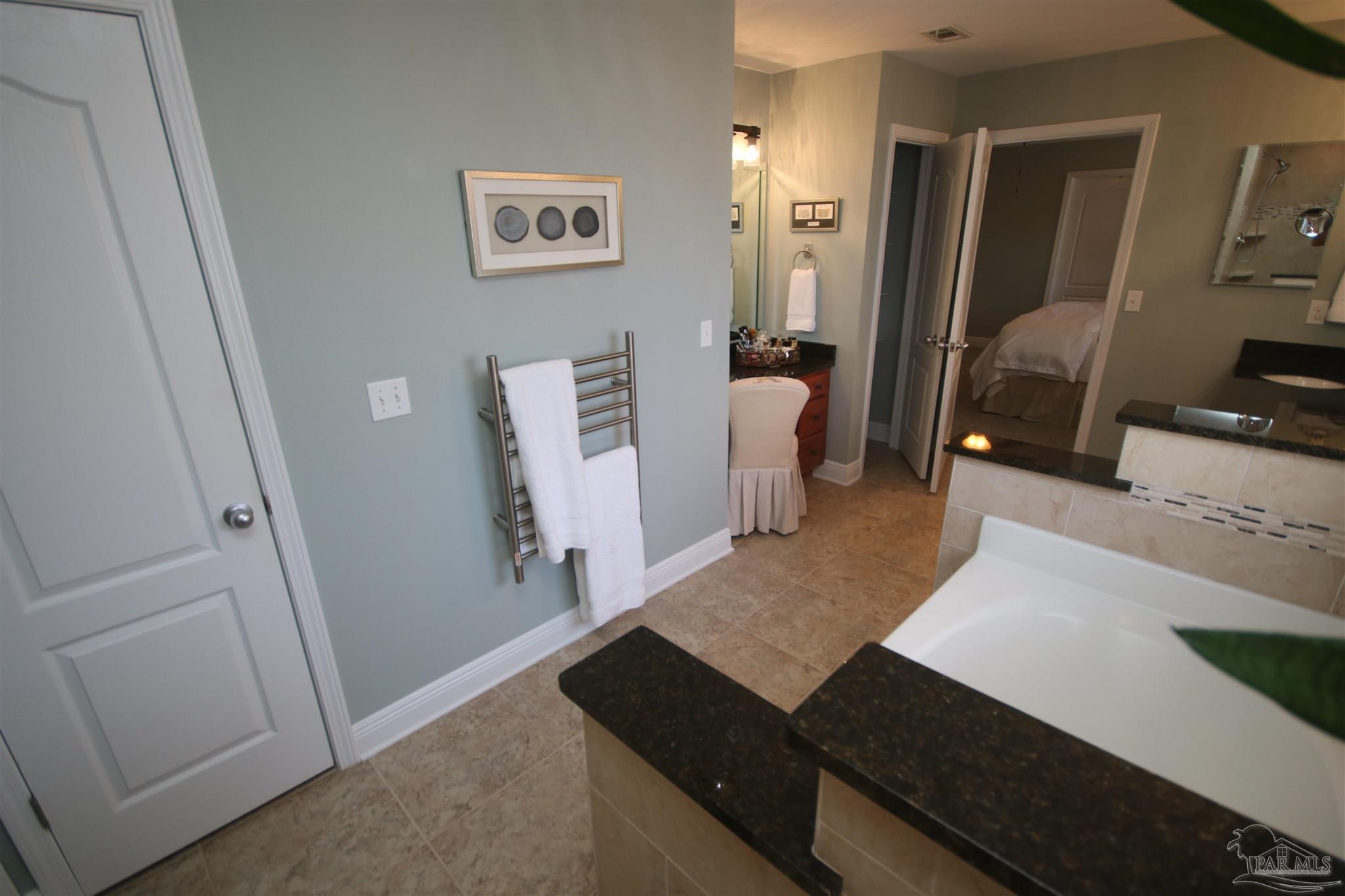 5790 Dunridge Drive Pace, FL 32571 - Photo 37 of 50 the garden tub. Two linen closets & make-up area.
