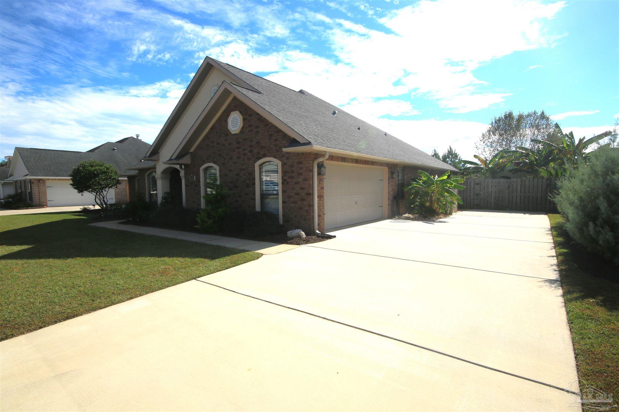 5790 Dunridge Drive Pace, FL 32571 - Photo 50 of 50 3/'19. Driveway extends 25'.5" beyond garage.