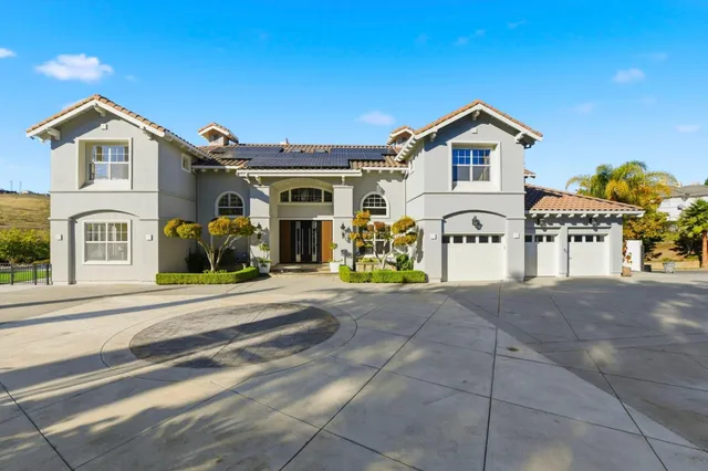 a view of multiple houses with a street