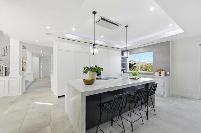 a kitchen with a table and chairs in it