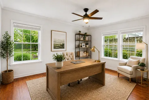 a dining room with wooden floor and a window