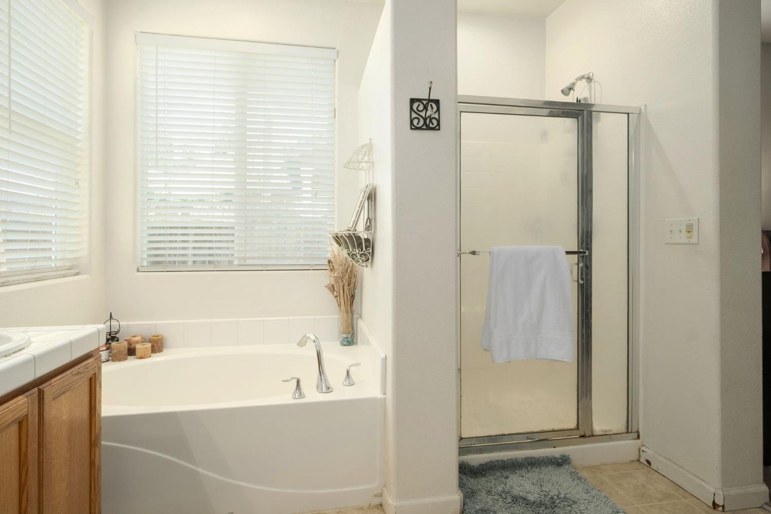 454 Sierra Avenue Reedley, CA 93654 - Photo 18 of 25 a white bath tub sitting next to a shower