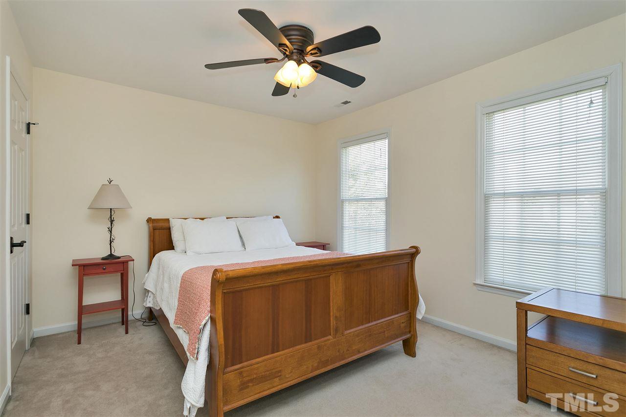 2337 Bolingbrook Lane Raleigh, NC 27613 - Photo 17 of 25 a bedroom with a bed and a large window