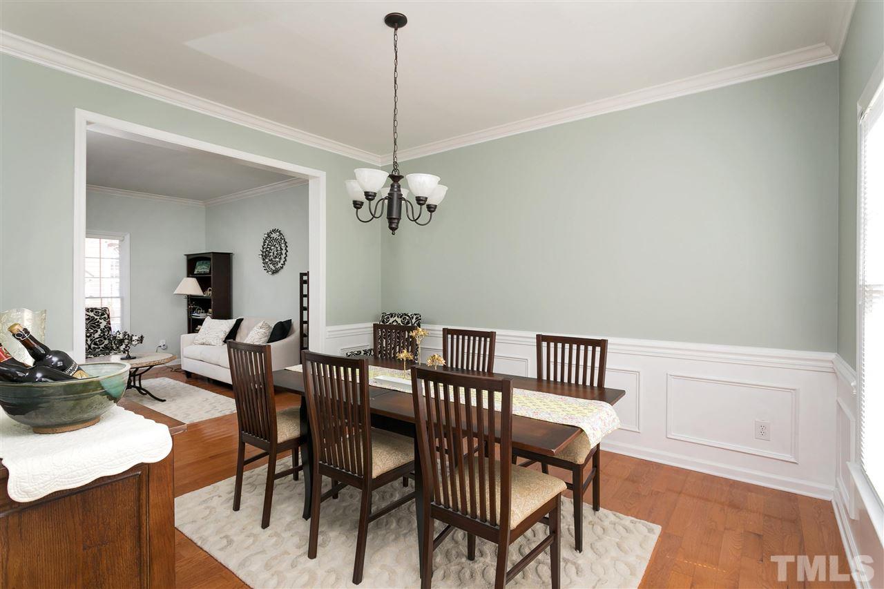 2337 Bolingbrook Lane Raleigh, NC 27613 - Photo 3 of 25 a view of a dining room with furniture and wooden floor