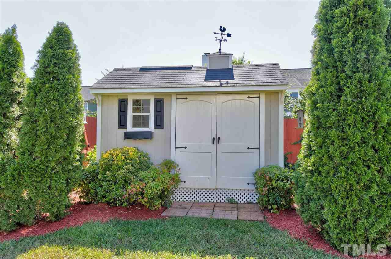 2337 Bolingbrook Lane Raleigh, NC 27613 - Photo 23 of 25 a front view of a house with a yard